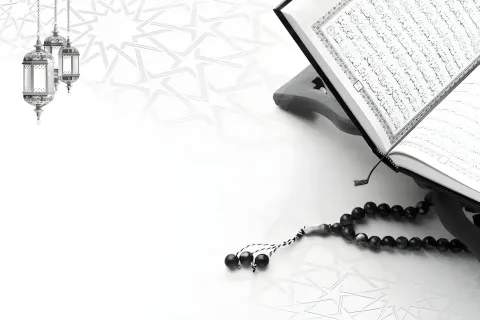 Open Qur'an with prayer beads